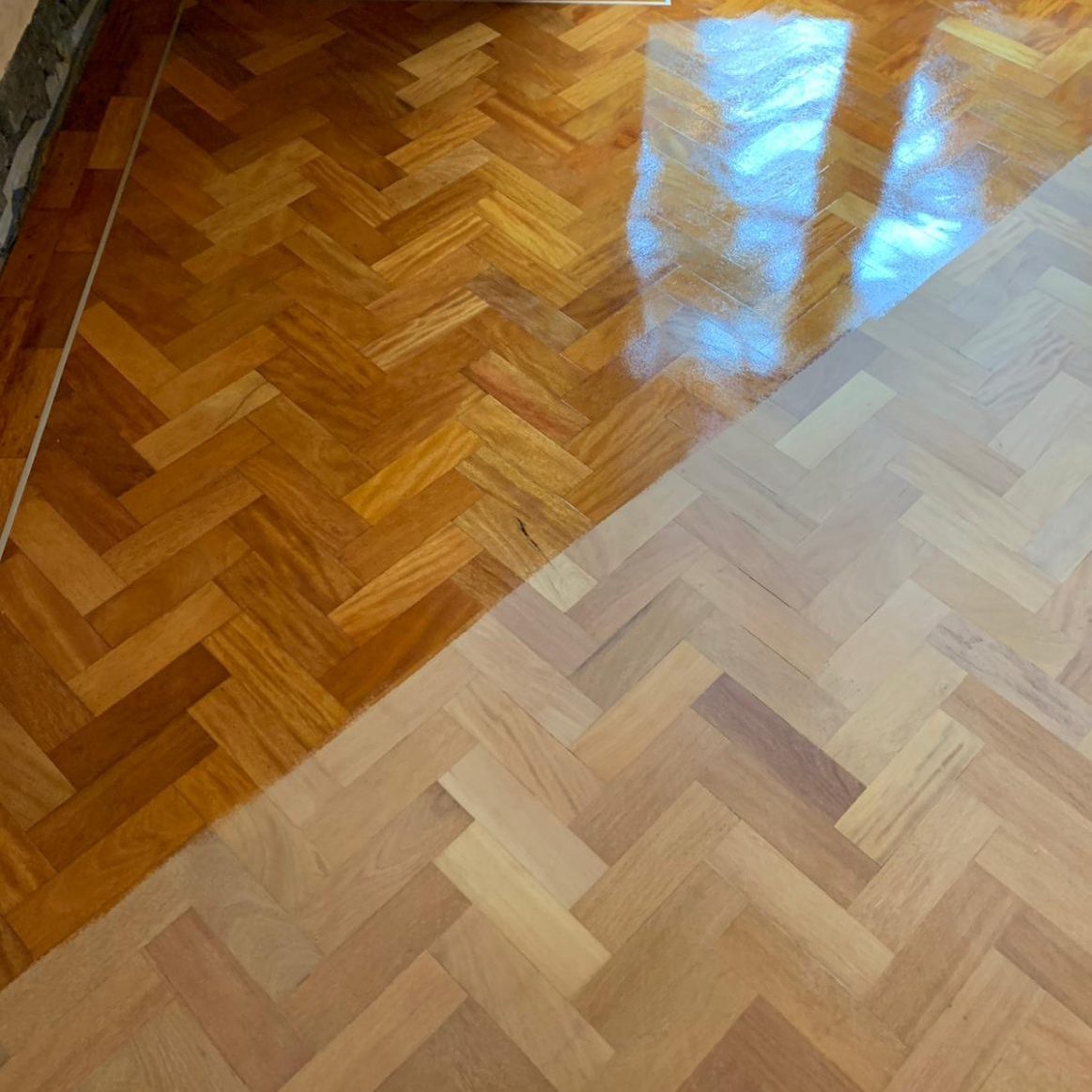 before and after varnishing a parquet wood floor